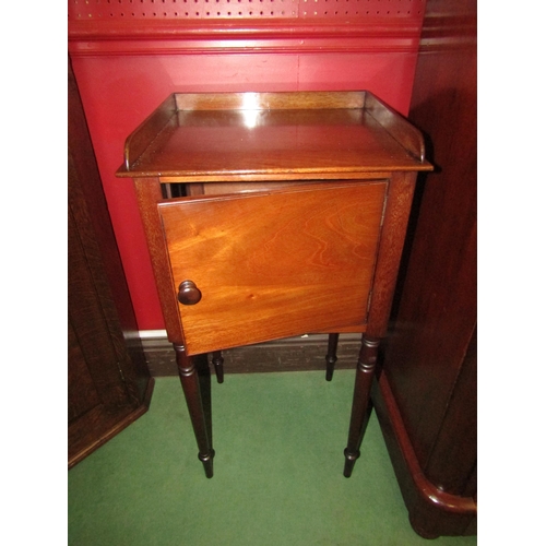 4042 - A 19th Century mahogany nightstand the three quarter raised top over a single door cupboard on fine ... 