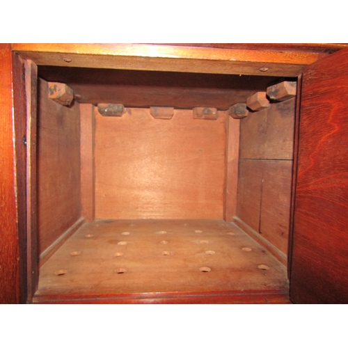 4042 - A 19th Century mahogany nightstand the three quarter raised top over a single door cupboard on fine ... 