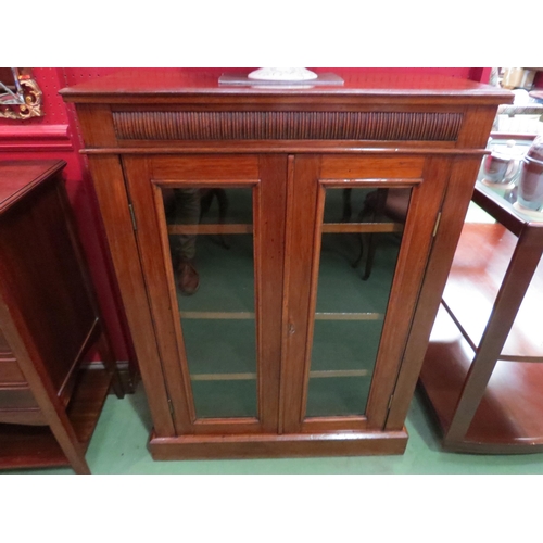 4062 - An Edwardian mahogany two door glazed bookcase with key over a plinth base, 103cm high x 76cm wide x... 