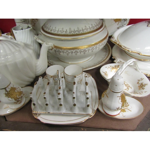 4008 - A selection of white ground and gilt embellished table wares including tureen, tea wares, Royal Albe... 