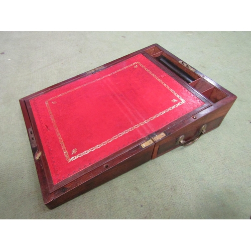 4012 - A mahogany writing slope with red tooled leather interior and secret drawers