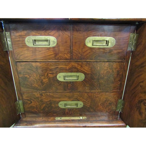 4013 - A figured walnut desktop campaign chest having two short over two long compartmented drawers, later ... 