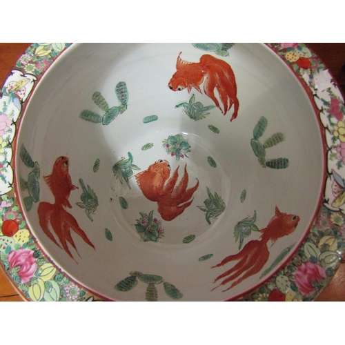 4027 - An Oriental bowl/planter with goldfish design to interior, floral design with figural panels to exte... 