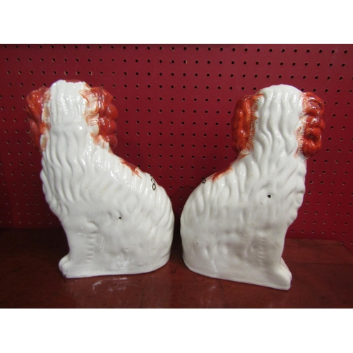 4044 - A pair of Staffordshire dogs, numbered 2 to bases, 26cm tall