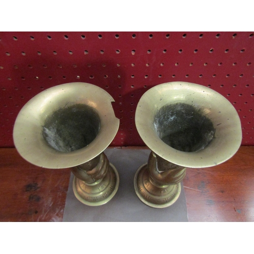 4060 - A pair of Oriental brass vases, chip to one rim, signed to base, 22cm tall               (R) £40