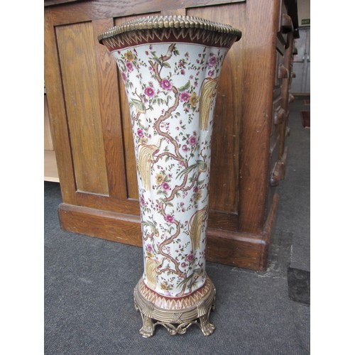 1069 - A late 20th Century ceramic stick stand having gilt brass mounts decorated with birds of paradise in... 