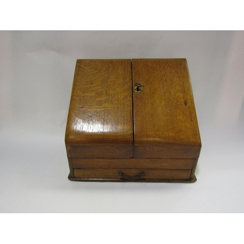 4247 - An oak table top stationery cabinet with fitted interior to include rotating calendar, original key,... 