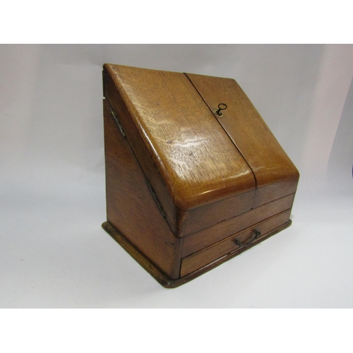 4247 - An oak table top stationery cabinet with fitted interior to include rotating calendar, original key,... 