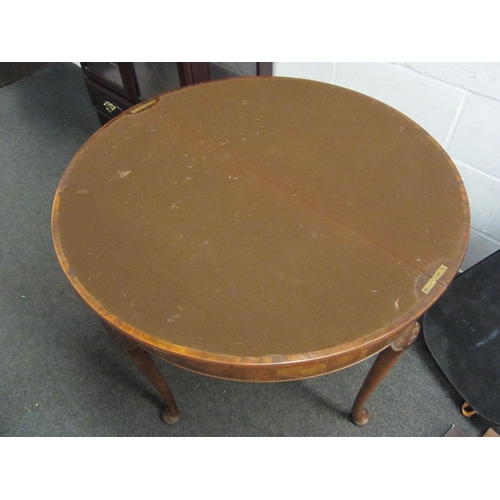 1055 - An early 20th Century mahogany demi-lune walnut card table with baize surface to interior on pad fee... 