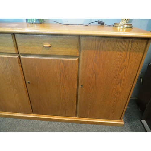 1065 - A modern oak sideboard, two short drawers over two cupboard doors flanked by doors, 82cm high x 170c... 