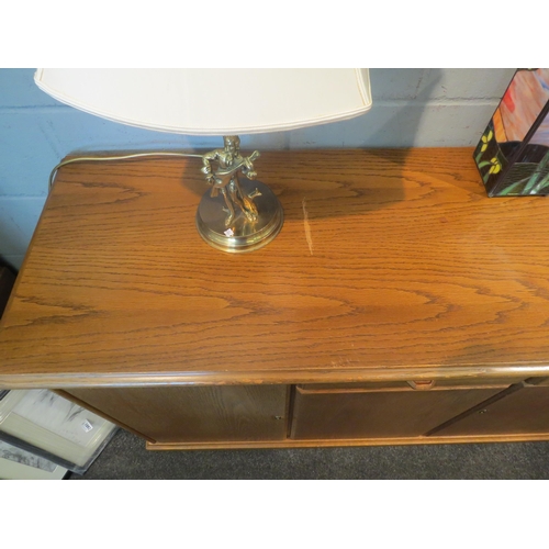 1065 - A modern oak sideboard, two short drawers over two cupboard doors flanked by doors, 82cm high x 170c... 