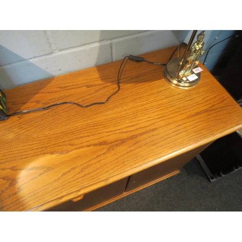 1065 - A modern oak sideboard, two short drawers over two cupboard doors flanked by doors, 82cm high x 170c... 
