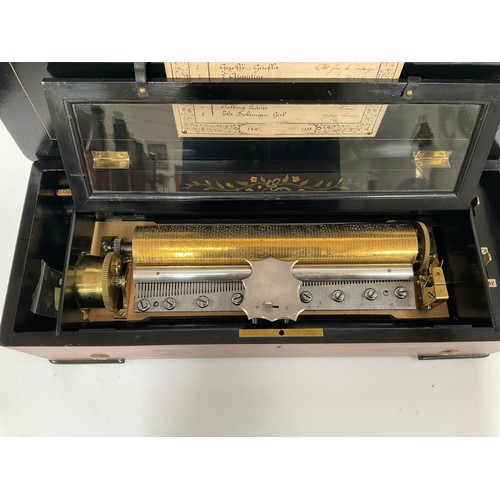 8010 - A late 19th Century Bremond cylinder music box playing 8 airs, with zither, flame walnut case and eb... 