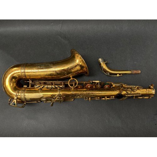 8002 - A Selmer MkVI saxophone, lacquered brass, with neck and mouthpiece, circa 1955, serial No.M59857, wi... 