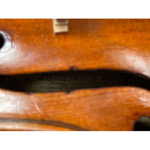 8055 - A 20th Century full size violin (4/4), label marked Monzino & Son, Stradivante, heavily restored, ca... 