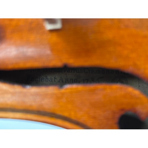 8055 - A 20th Century full size violin (4/4), label marked Monzino & Son, Stradivante, heavily restored, ca... 