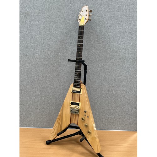 8179 - A 1970s Flying V electric guitar with segmented hardwood and ash body, thought to be by Kay, hard fl... 