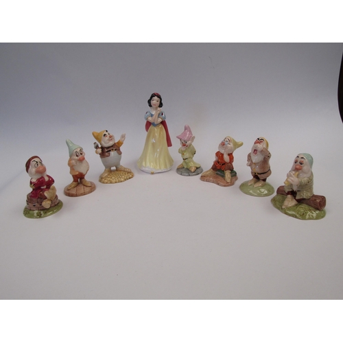 9104 - A set of Royal Doulton Snow White and the Seven Dwarfs figures - 