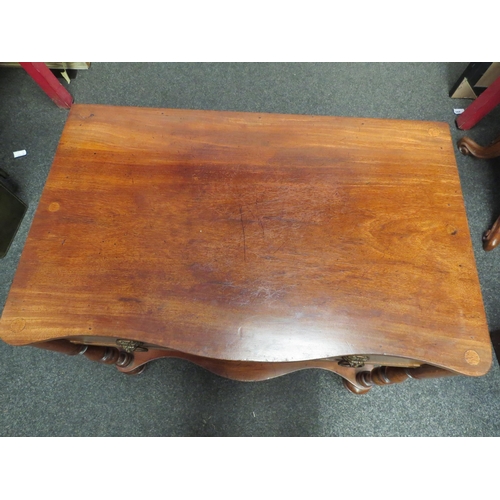 1104 - An occasional table on castors, lion mask handles and under-tier   (E) £15-25