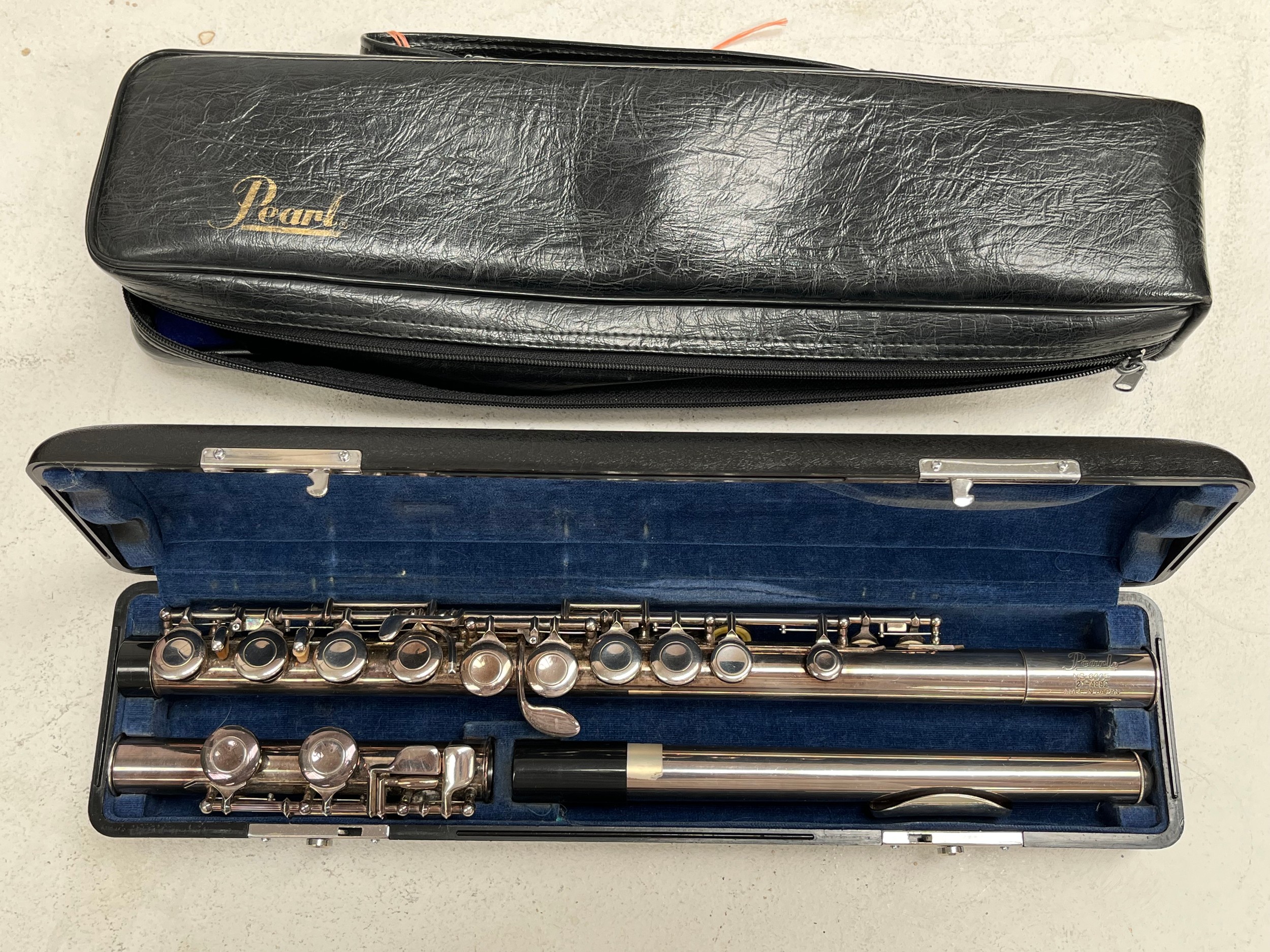 A Pearl NS-600E flute, 21-4892, made in Japan, cased and with cover