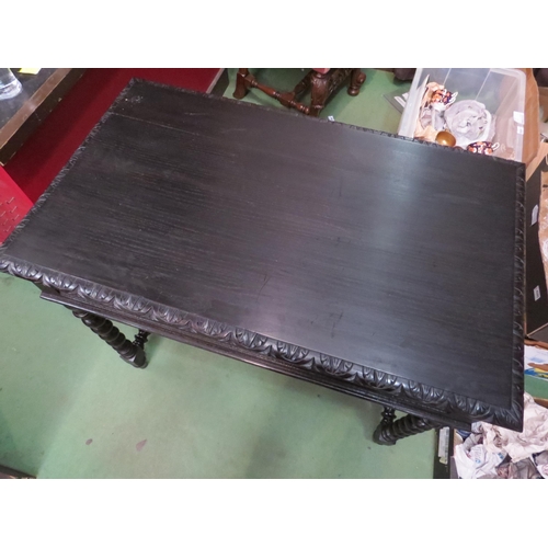 4001 - A 17th Century style ebonised oak table the carved edge top on barley-twist turned legs and 