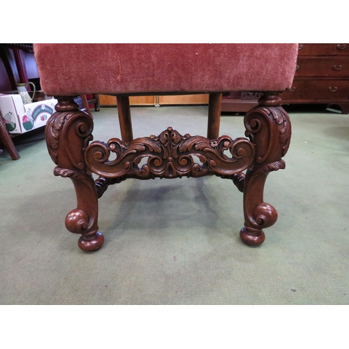 4002 - A George II revival carved walnut chair the camel hump back rest over acanthus leaf scroll carved fo... 