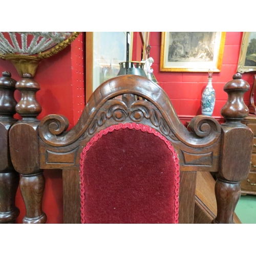 4024 - A pair of 17th Century style high-back oak chairs with carved decoration the turned finials on turne... 