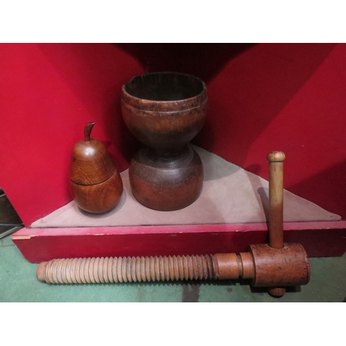 4066 - A large treen vessel, 26cm high, wooden lidded pear and a book press screw (3)