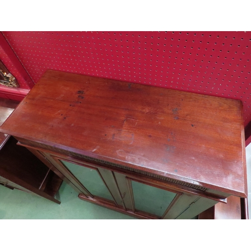 4077 - An Edwardian mahogany two door glazed bookcase with key over a plinth base, 103cm high x 76cm wide x... 