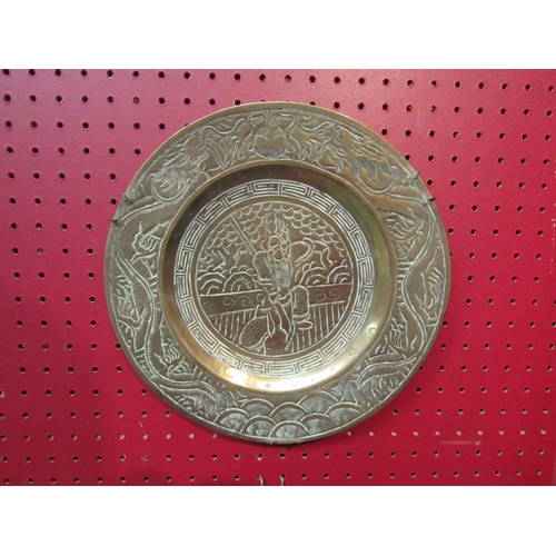 4096 - A pair of Japanese brass chargers with character marks to base, 26cm diameter