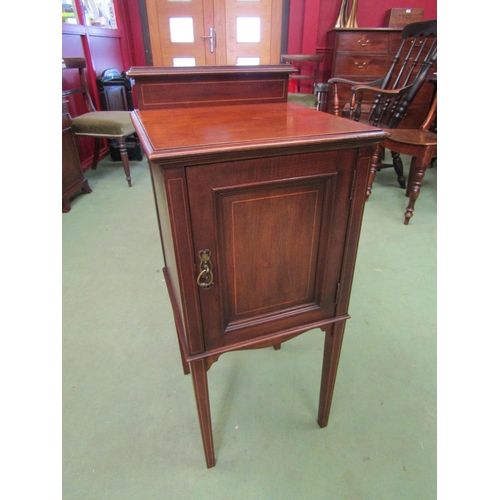 4103 - An Edwardian mahogany line inlaid bedside cabinet the raised back and single door cupboard on square... 