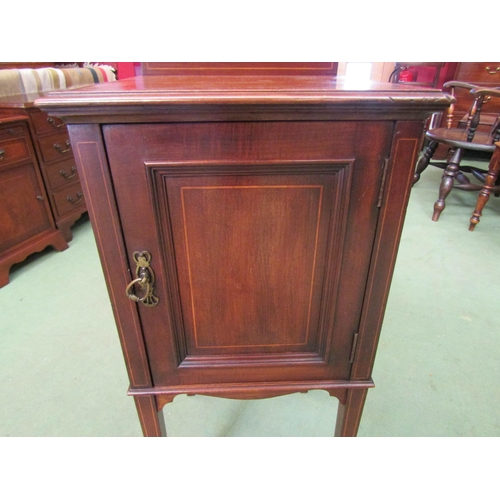 4103 - An Edwardian mahogany line inlaid bedside cabinet the raised back and single door cupboard on square... 