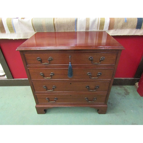 4113 - A George III revival mahogany four graduating long drawer chest of small proportions with brass swan... 