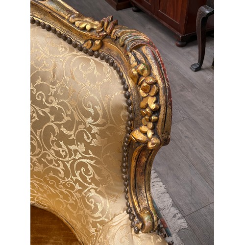 4125 - A pair of French lady's and gent's fireside armchairs, gilded carved wooden frames with scrolls and ... 