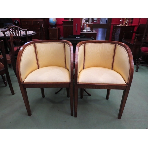 4131 - A pair of Art Deco oak armchairs with silk upholstery over square tapering legs, 81cm high   (R) £90