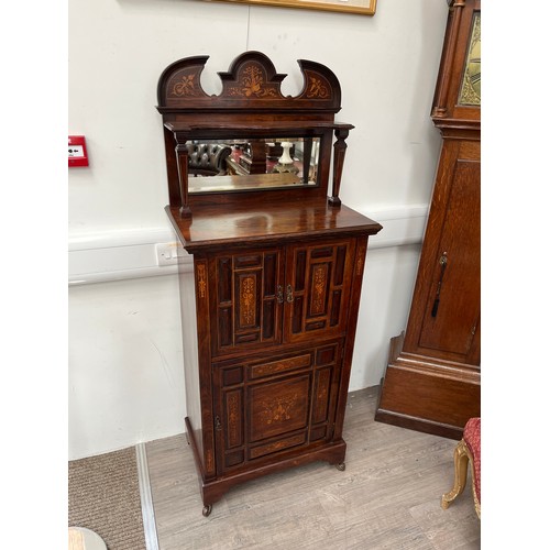 4141 - A Victorian rosewood mirror-back music cabinet, marquetry panels of musical instruments, twin door o... 