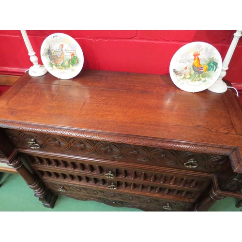 4146 - A 19th Century oak breakfront chest of four drawers having carved and turned decoration with turned ... 