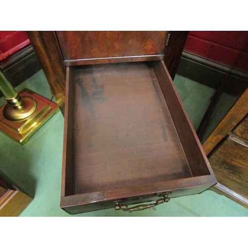 4157 - A George III mahogany canted corner washstand, the rising lid with baize interior over a single door... 