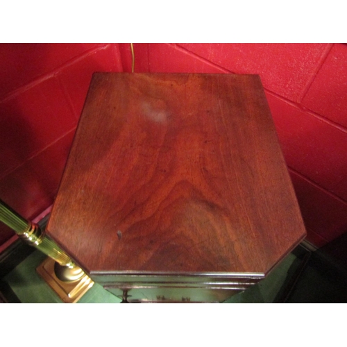 4157 - A George III mahogany canted corner washstand, the rising lid with baize interior over a single door... 