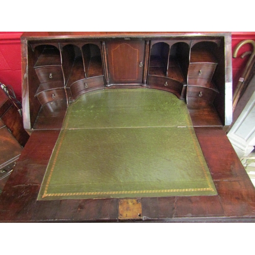 4161 - An 18th Century bureau with single drawer flanked by brushing slides, two short over two graduated l... 