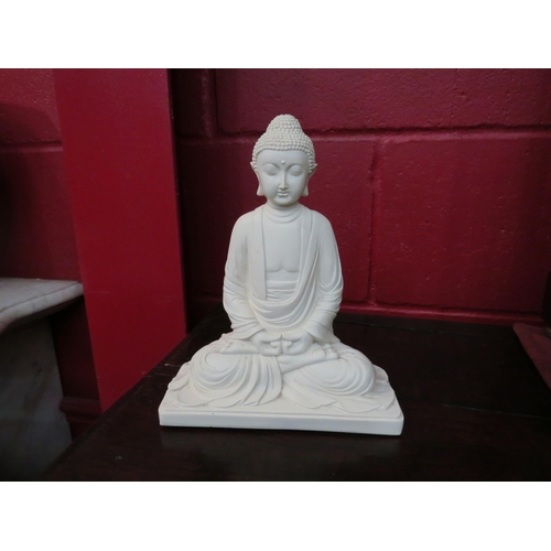 4174 - A model of a sitting Buddha, 22cm tall