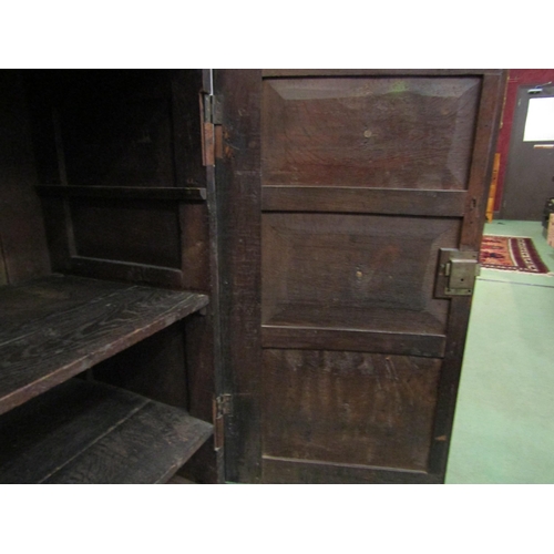 4177 - A 17th Century and later pegged oak two door cupboard with geometric and bobbin turned moulded decor... 