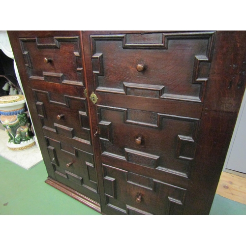 4177 - A 17th Century and later pegged oak two door cupboard with geometric and bobbin turned moulded decor... 