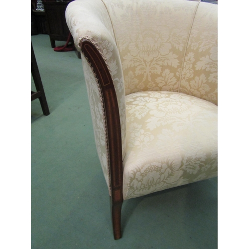 4186 - An Edwardian crossbanded mahogany tub chair on sabre fore legs