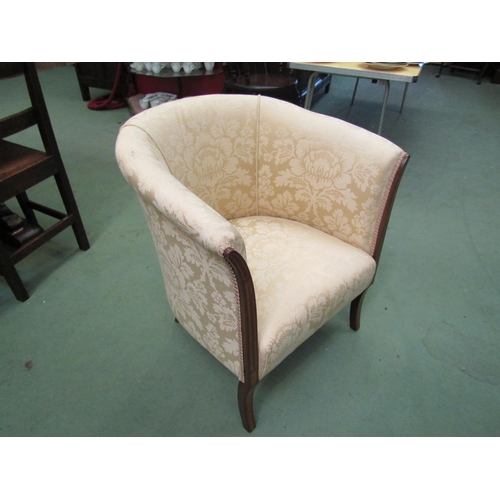 4186 - An Edwardian crossbanded mahogany tub chair on sabre fore legs