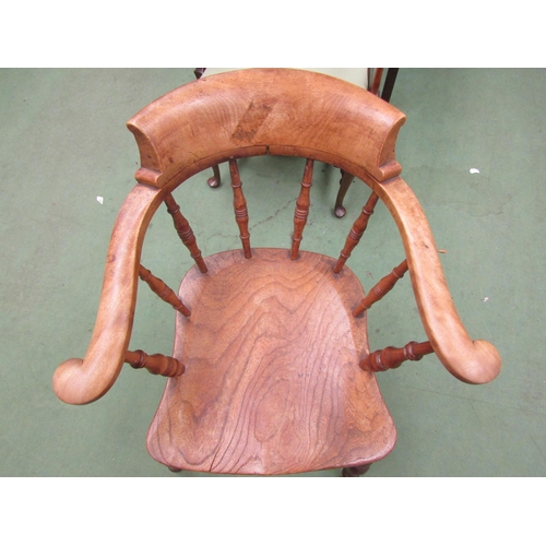 4200 - A 19th Century elm seated captains chair with turned spindle back