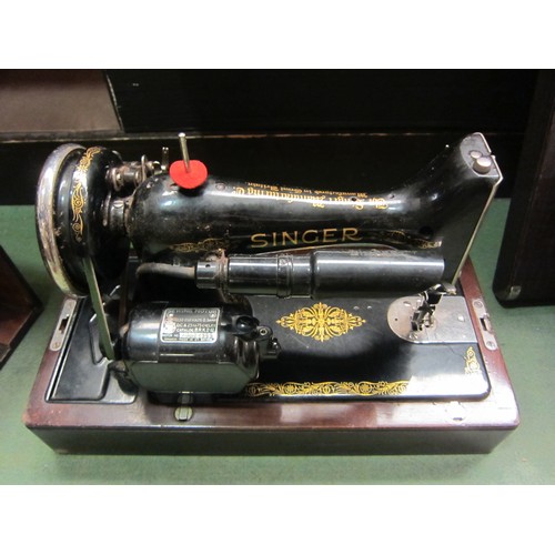 4252 - A cased Singer sewing machine with motor attached, serial no. ED882971