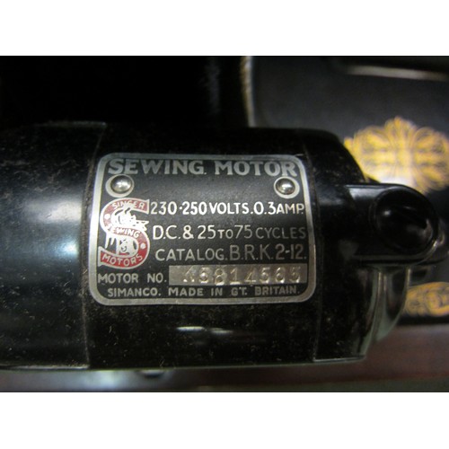 4252 - A cased Singer sewing machine with motor attached, serial no. ED882971