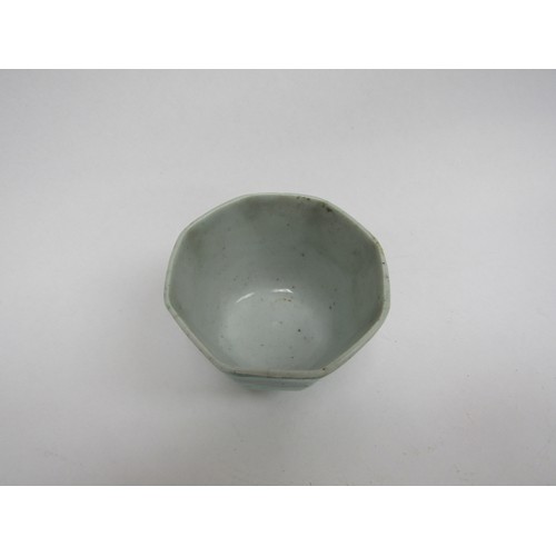 4327 - A Celadon green facet tea bowl with seal mark to base, hairlined