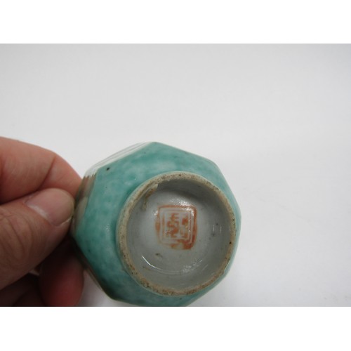 4327 - A Celadon green facet tea bowl with seal mark to base, hairlined